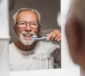 Benefits of dental implants include easier care and maintenance compared to dentures and dental bridges