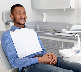 Smiling male patient in dental chair