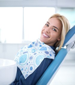 Smiling woman sitting in dental office