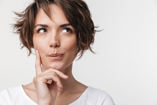 closeup of young woman thinking 